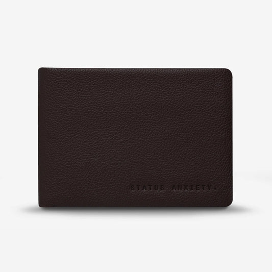 The Status Anxiety Jonah Wallet in Chocolate on a blank background