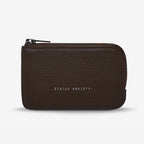 The Status Anxiety Left Behind Wallet in Cocoa on a blank background