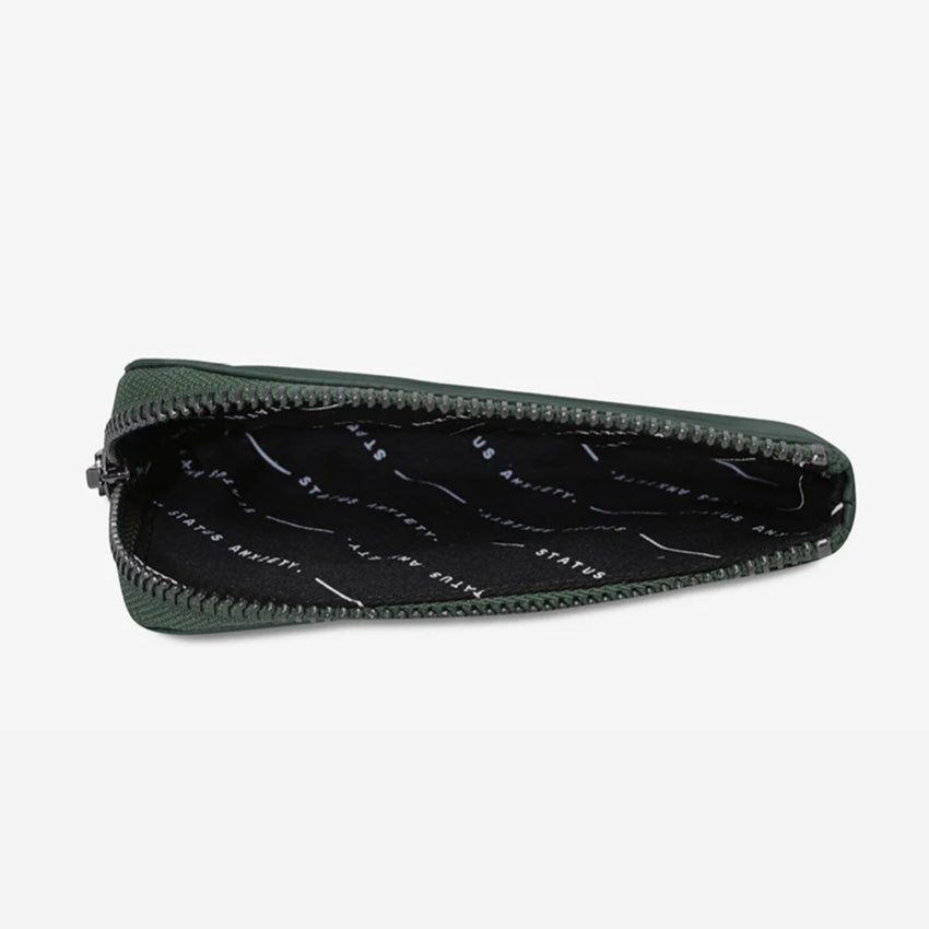 The inside of the Status Anxiety Left Behind Wallet in Teal on a blank background