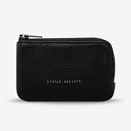 The Status Anxiety Left Behind Wallet in Black on a blank background
