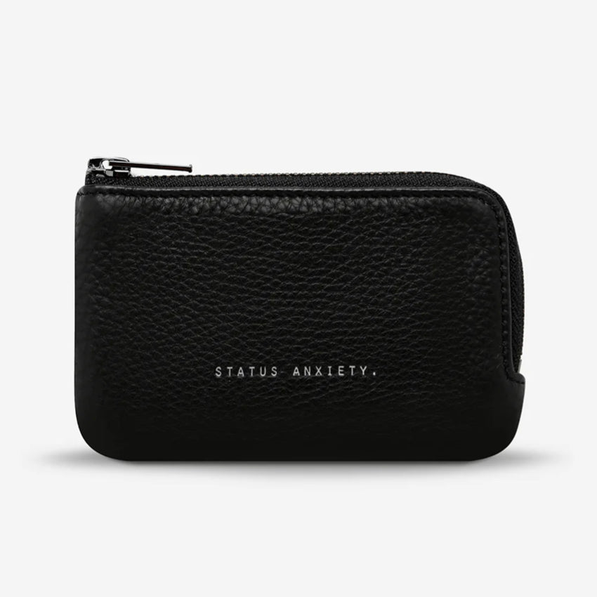 The Status Anxiety Left Behind Wallet in Black on a blank background