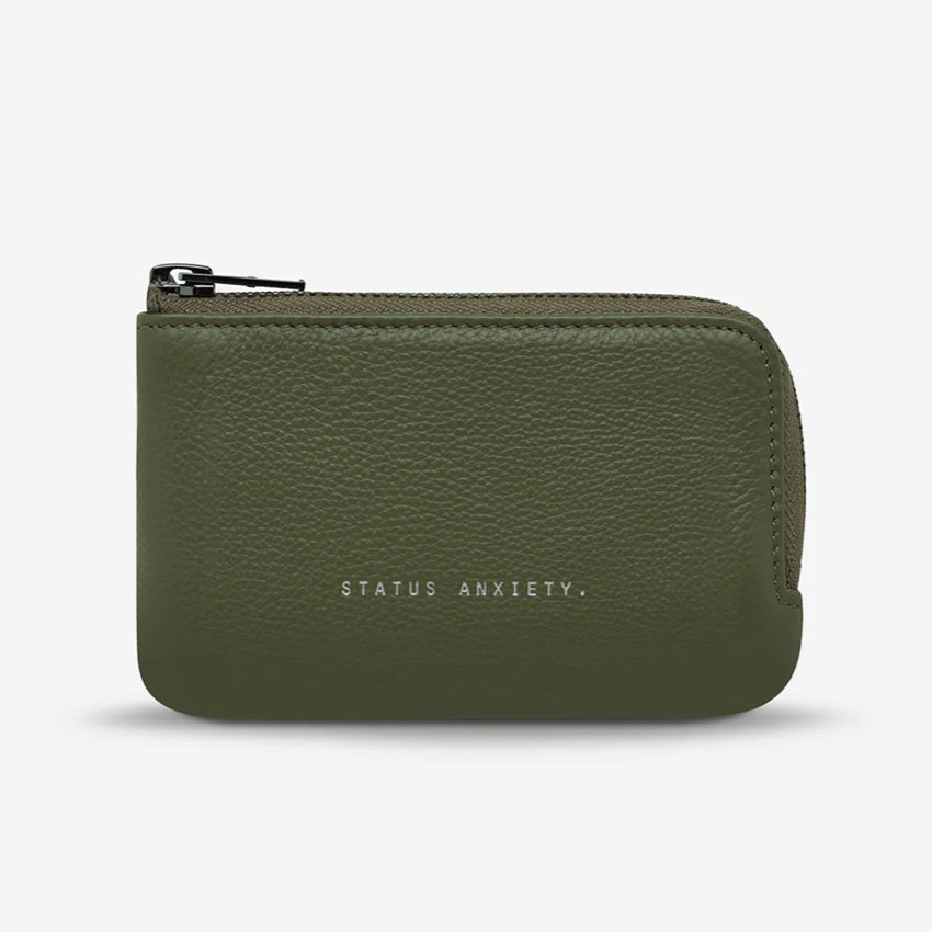 The Status Anxiety Left Behind Wallet in Khaki on a blank background