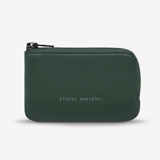 The Status Anxiety Left Behind Wallet in Teal on a blank background