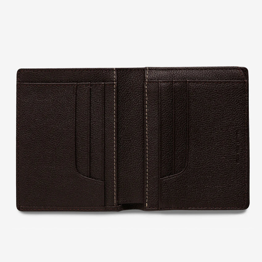 The Status Anxiety Jonah Wallet in Chocolate open on a blank background