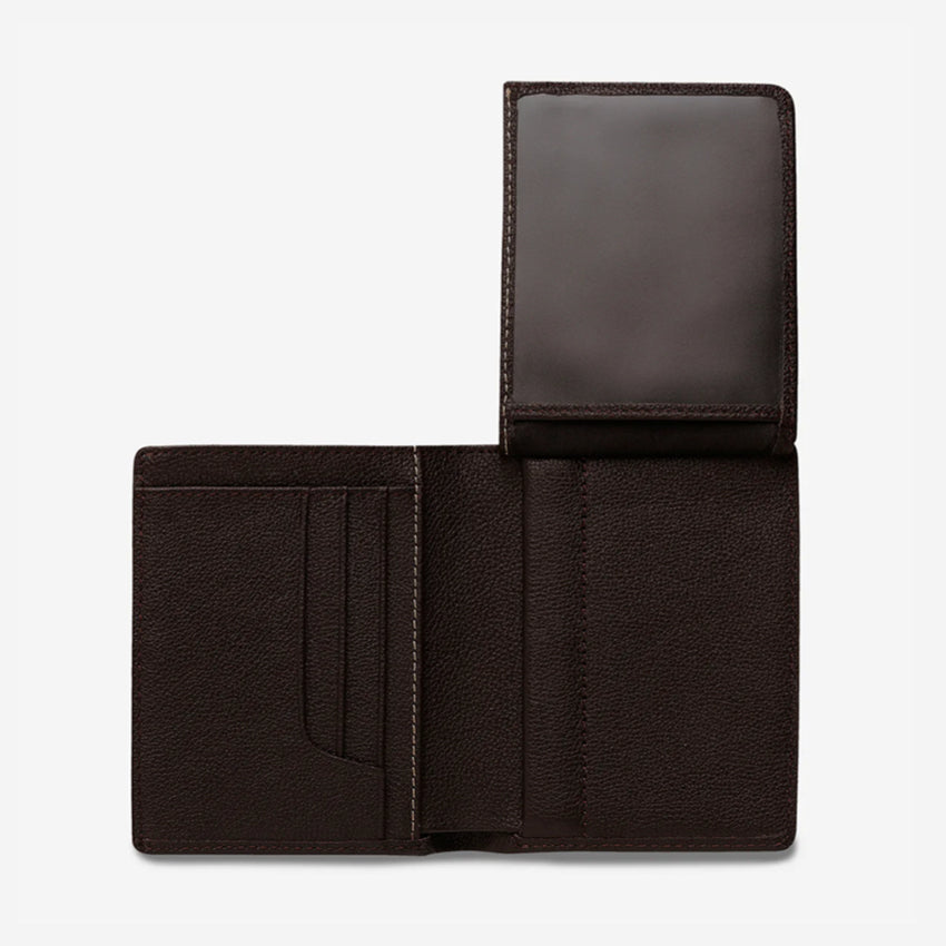 The Status Anxiety Jonah Wallet in Chocolate open with the flap up on a blank background