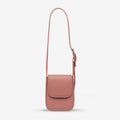 The Status Anxiety Perplex Bag in Dusty Rose on a blank background