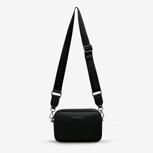 The Status Anxiety Plunder Bag with Webbed Strap in Black on a blank background