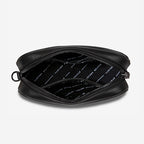 A top view of the Status Anxiety Plunder Bag with Webbed Strap in Black open on a blank background