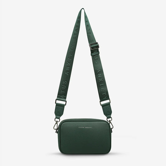 The Status Anxiety Plunder Bag with Webbed Strap in Green on a blank background