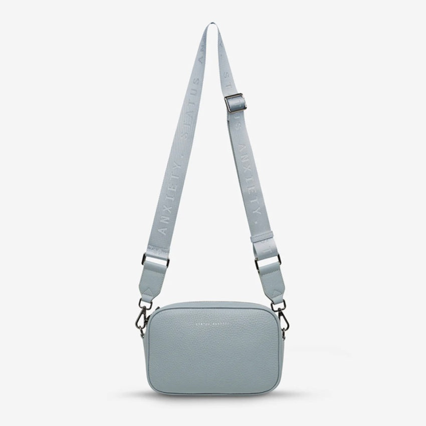 The Status Anxiety Plunder Webbed Strap in Powder Blue on a blank background