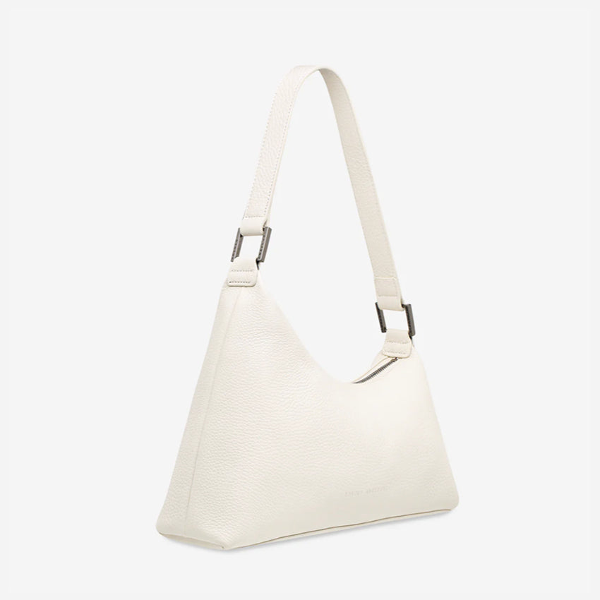 The side profile of the Status Anxiety Reverie Handbag in Chalk on a blank background