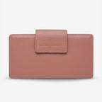 The Status Anxiety Ruins Wallet in Dusty Rose on a Blank Background