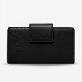 The Status Anxiety Ruins Wallet in Black on a Blank Background