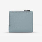 The backside of the Status Anxiety Sense Of Wonder Wallet in Powder Blue on a blank background