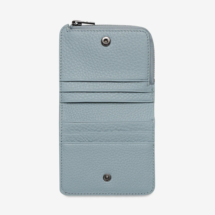 The Status Anxiety Sense Of Wonder Wallet in Powder Blue open on a blank background