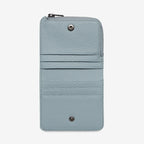 The Status Anxiety Sense Of Wonder Wallet in Powder Blue open on a blank background
