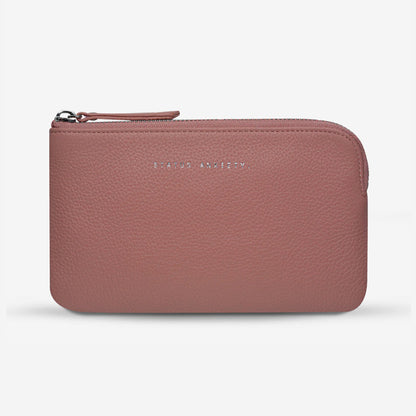 The Status Anxiety Smoke and Mirrors Wallet in Dusty Pink on a blank background