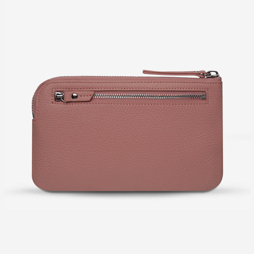The back view of the Status Anxiety Smoke and Mirrors Wallet in Dusty Pink on a blank background