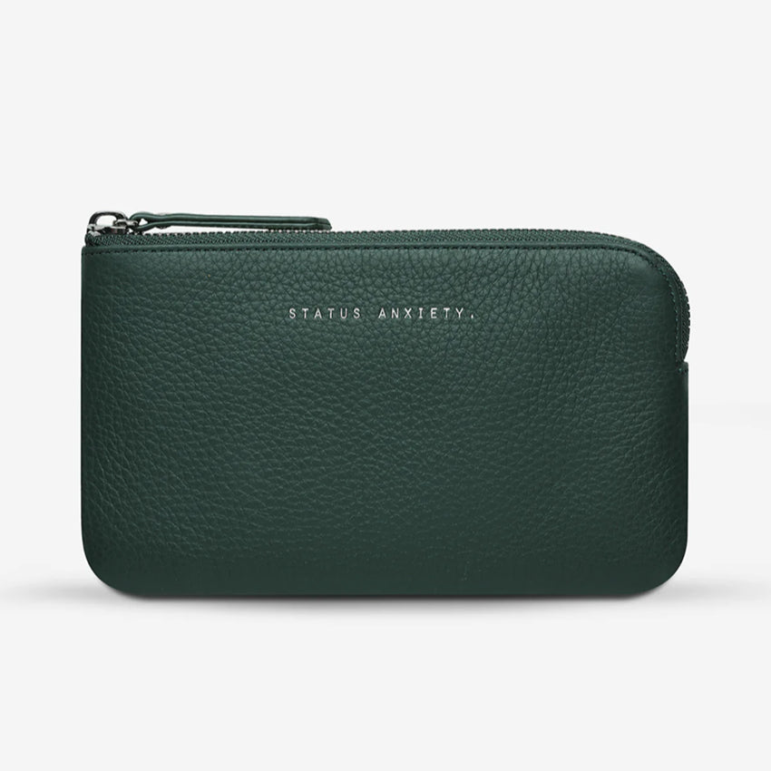 The Status Anxiety Smoke and Mirrors Wallet in Teal on a blank background