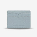 The Status Anxiety Together For Now Wallet in Powder Blue on a blank background