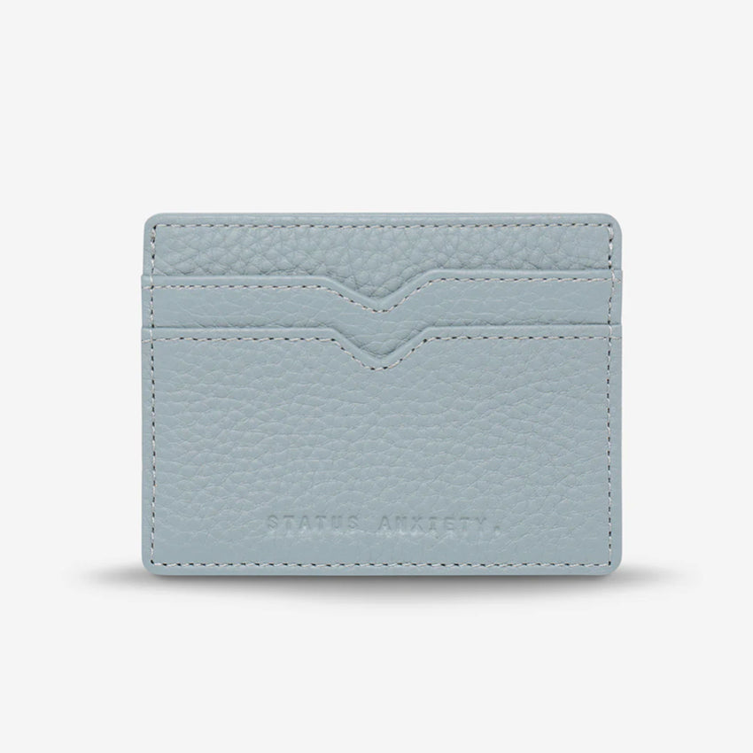 The Status Anxiety Together For Now Wallet in Powder Blue on a blank background