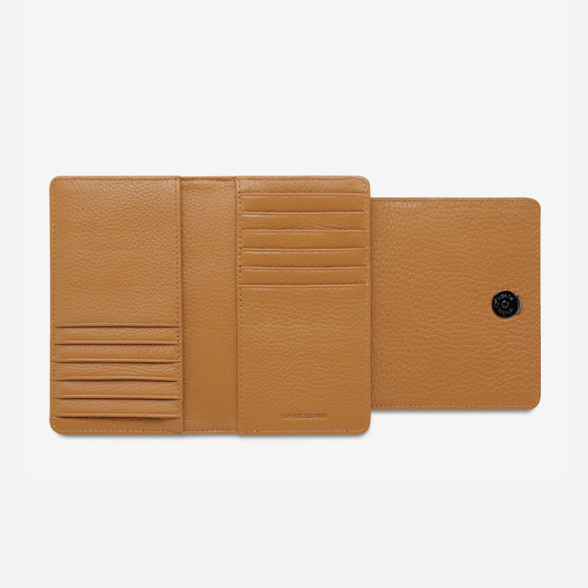 The Status Anxiety Visions Wallet in Tan open on a blank background
