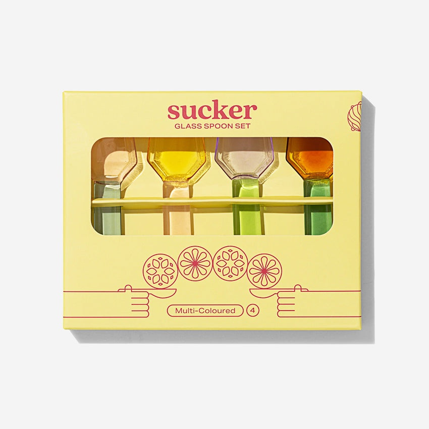 The Sucker Glass Spoon Set in the box packaging on a blank background