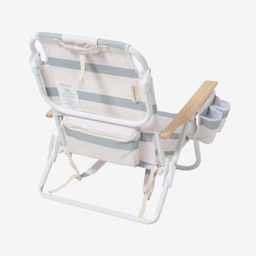 A back view of the SunnyLife Deluxe Beach Chair in Sea Sage Stripe on a grey background