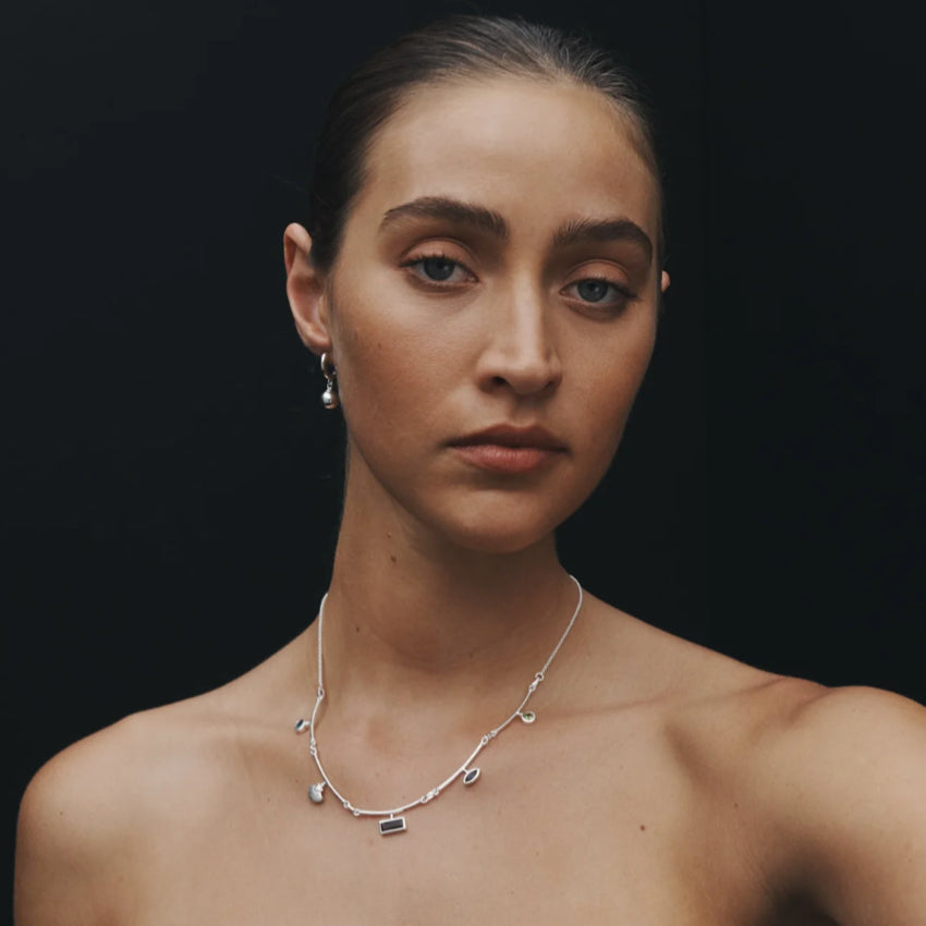 The Temple Of The Sun Alba Huggies in Sterling Silver on a model