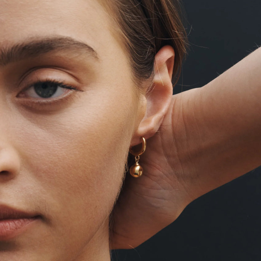 The Temple Of The Sun Alba Huggies in Gold Vermeil on a model