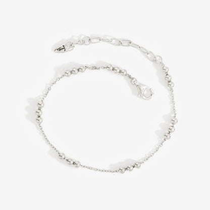 The Temple Of The Sun Alba Station Bracelet in Sterling Silver on a grey background