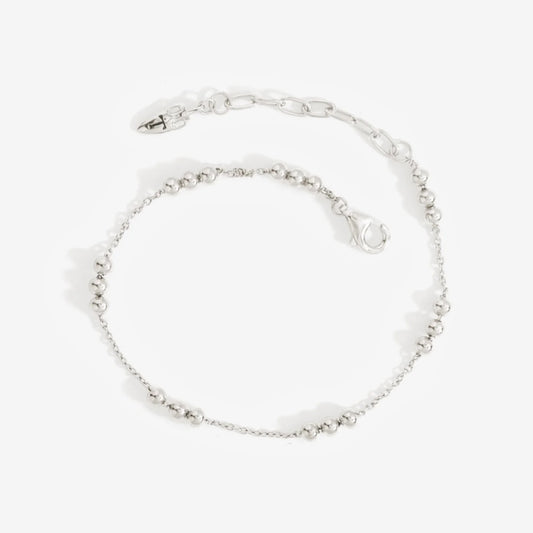 The Temple Of The Sun Alba Station Bracelet in Sterling Silver on a grey background
