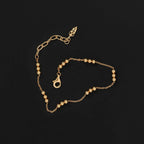 The Temple Of The Sun Alba Station Bracelet in Gold on a black background
