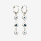 The Temple Of The Sun Blessing Earrings in Sterling Silver on a grey background