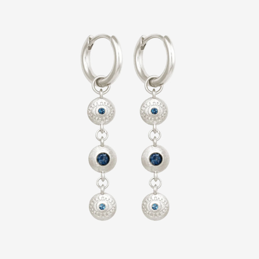 The Temple Of The Sun Blessing Earrings in Sterling Silver on a grey background