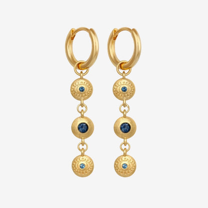 The Temple Of The Sun Blessing Earrings in Gold on a grey background