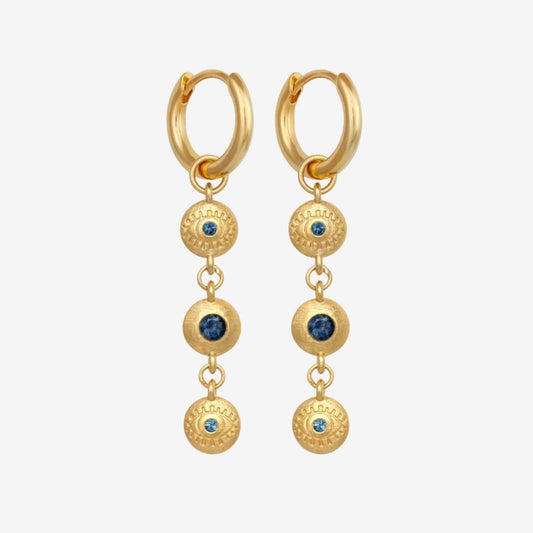 The Temple Of The Sun Blessing Earrings in Gold on a grey background