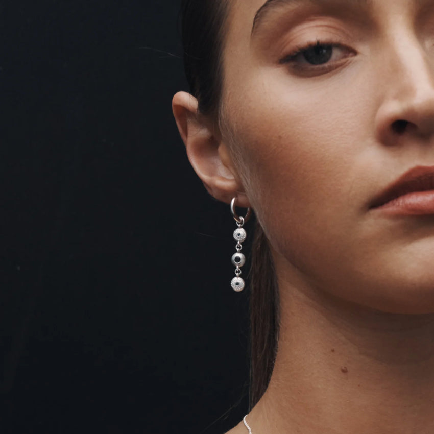 The Temple Of The Sun Blessing Earrings in Sterling Silver on a model