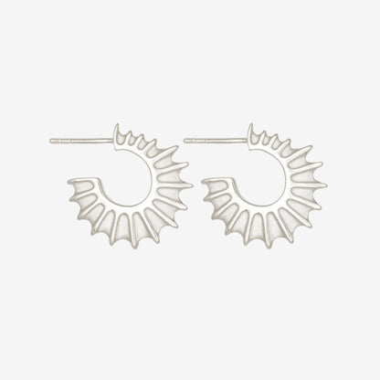 The Temple Of The Sun Calypso Hoops in Sterling Silver on a grey background
