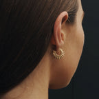 The Temple Of The Sun Calypso Hoops in Gold Vermeil on a model