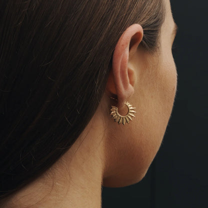The Temple Of The Sun Calypso Hoops in Gold Vermeil on a model