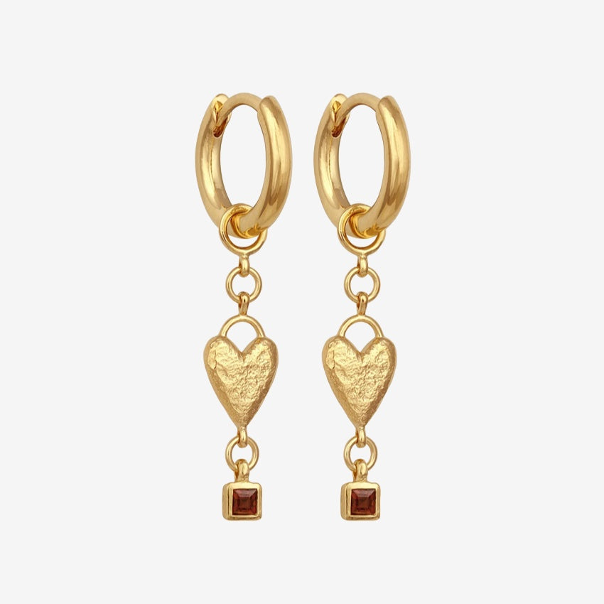 The Temple Of The Sun Eros Earrings in Gold on a blank background