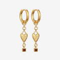 The Temple Of The Sun Eros Earrings in Gold on a blank background