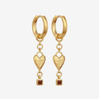 The Temple Of The Sun Eros Earrings in Gold on a blank background