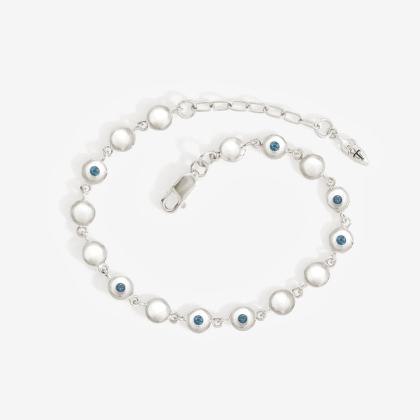 The Temple Of The Sun Mavi Chain Bracelet in Sterling Silver on a grey background