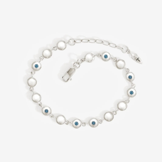 The Temple Of The Sun Mavi Chain Bracelet in Sterling Silver on a grey background