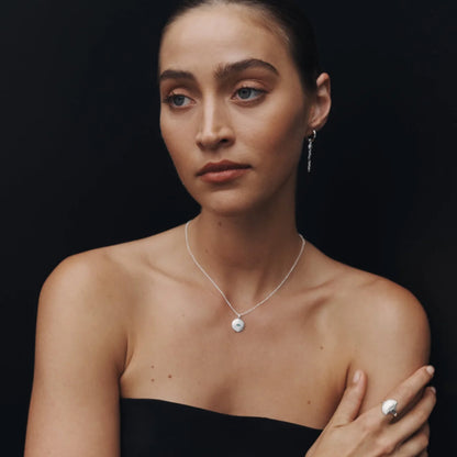 The Temple Of The Sun Mavi Eye Necklace in Sterling Silver on a model