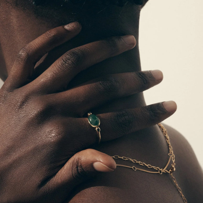 A model wearing the Temple Of The Sun Opis Ring in Gold 