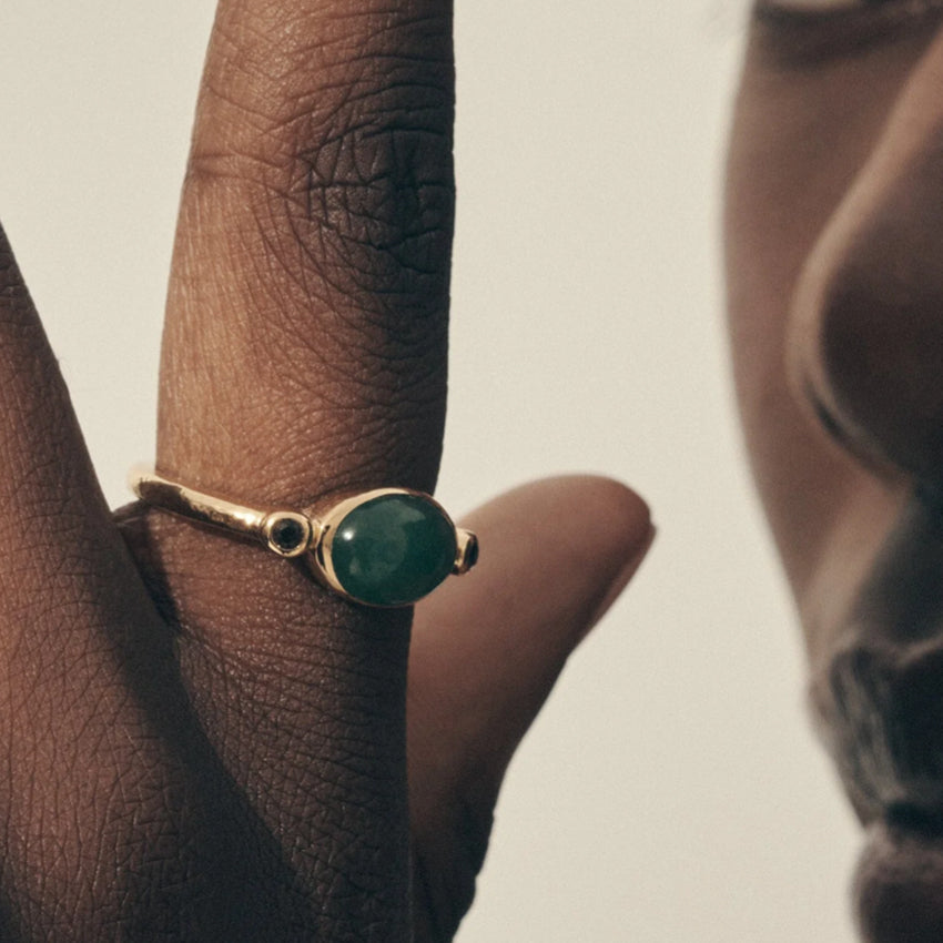 A model wearing the Temple Of The Sun Opis Ring in Gold 