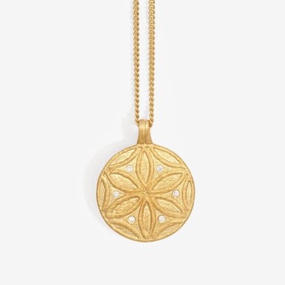 The Temple Of The Sun Seed Of Life Necklace in Gold on a grey background